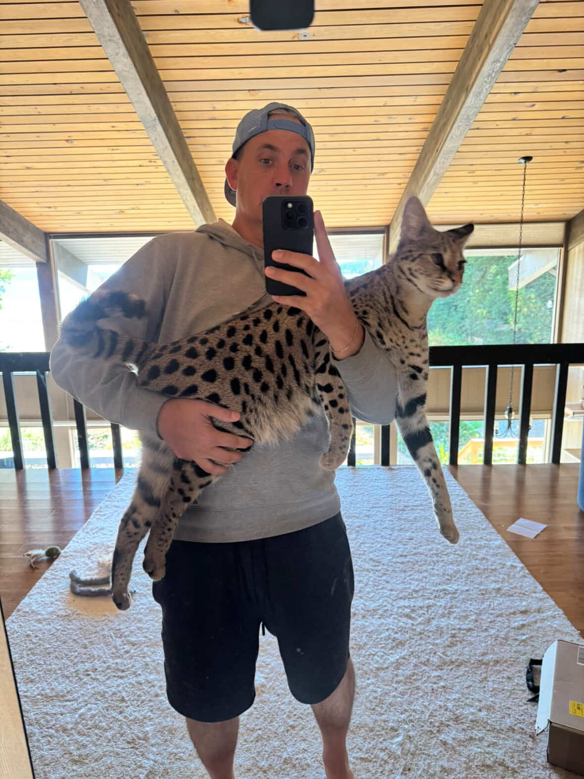 Odin held by Elliott, showing his size at 19 pounds