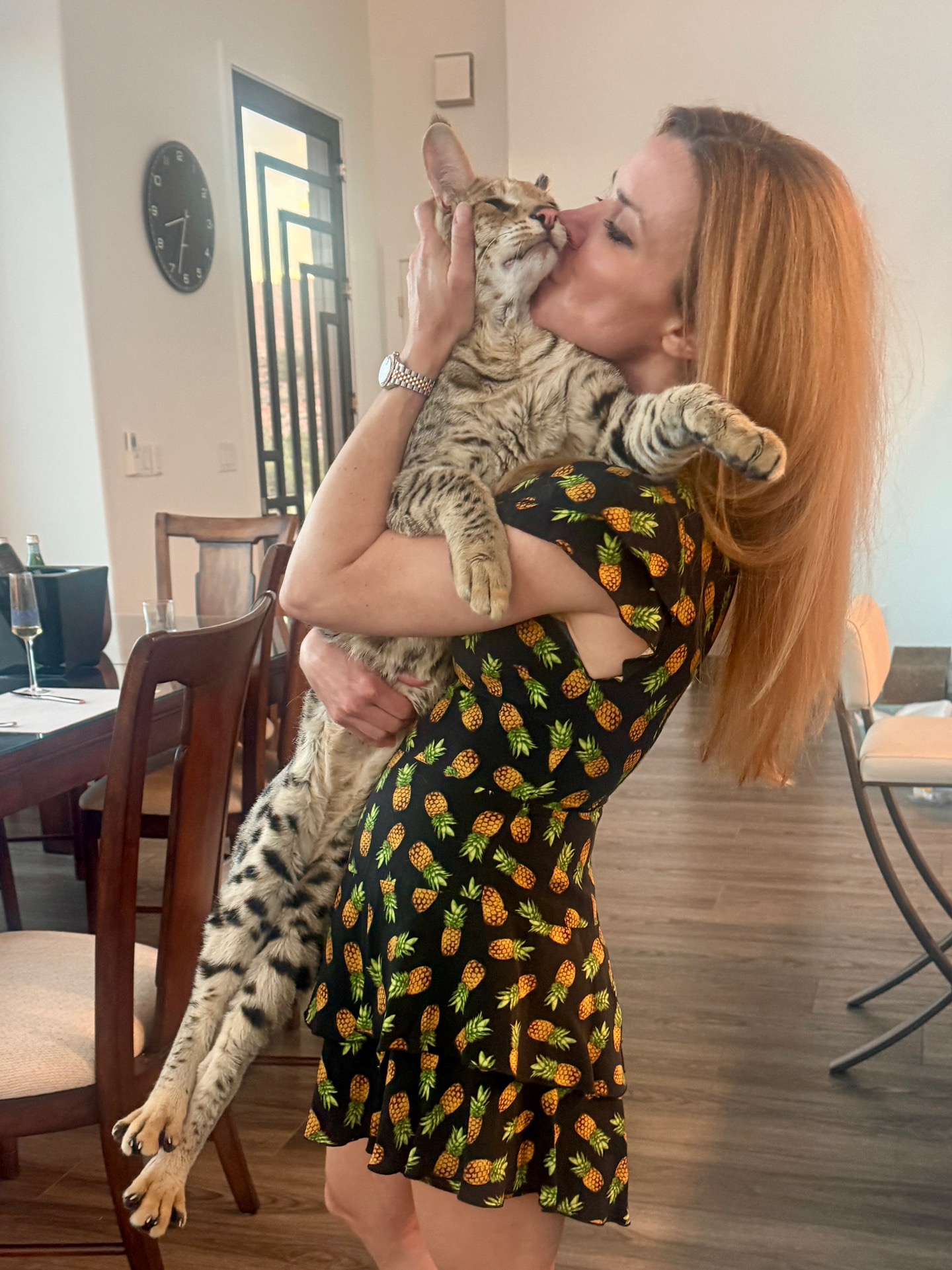 Max held up close in a loving embrace at home